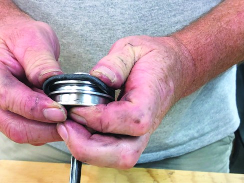 Select the proper replacement O-ring and slip it into place on the piston (17). While working on the driver-piston assembly, check to make sure the end of the driver shaft is not damaged or worn. If you have the measuring tools, make sure that the distance from the piston to the end of the shaft is within the manufacturer’s specs. Adjusting the shaft is best done by a service technician.