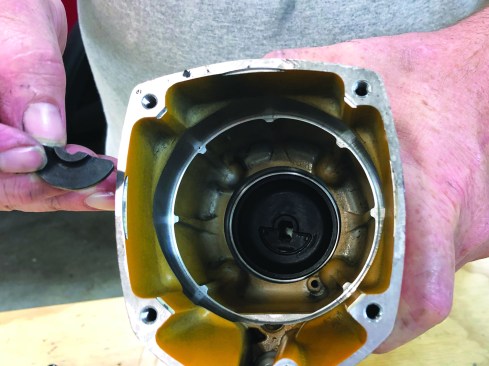 The last parts to clean are the cylinder ring, which has an O-ring that needs to be replaced in the usual fashion, and the cylinder seal (not shown). With all the parts clean and properly lubricated and with the O-rings replaced correctly, it’s time to reassemble the nailer. The locator plate (removed earlier) is a half-round piece of metal that guides the driver shaft.