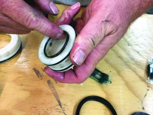After making sure that the new O-ring is completely coated with lubricant, slip it into the groove on the head valve.