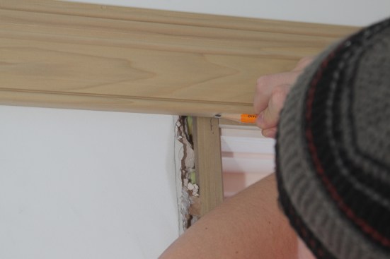 Next he marks the length of the head casing by transferring the reveal mark.