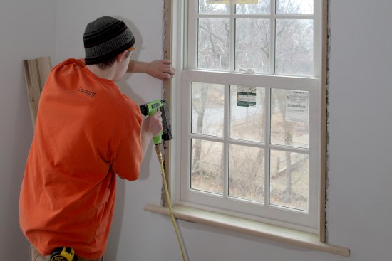 The factory jambs that came with the windows were about 1/2-inch shy of the drywall surface. So the carpenter installed strips to build the jambs out flush with the wall.
