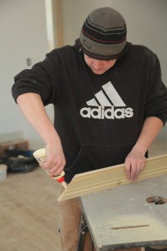 To glue a biscuit joint, apply yellow glue to the slot. Then insert the biscuit in the slot and smear glue on the biscuit itself.