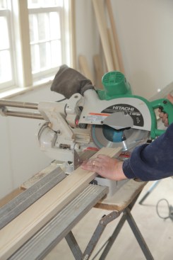 The apron trim that goes under the stool has end returns where the profile turns the corner back to the wall. Make the returns by first cutting 45 degree angles on both ends of the stock. Note that you are not cutting stock to length at this point. 