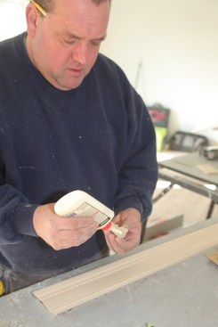 With the apron cut to length, spread glue on the returns for the ends.