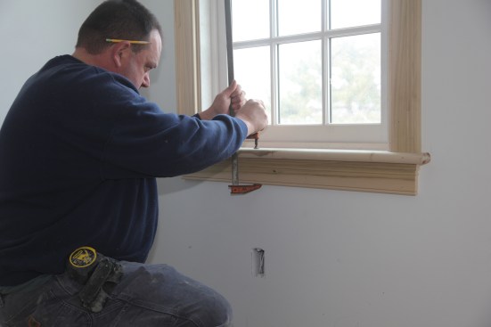 If the stool or apron are not perfectly straight, draw them together with a clamp before fastening the apron. If the gap between the two pieces is large, you can use construction adhesive or carefully driven finish nails to hold the two pieces together. 