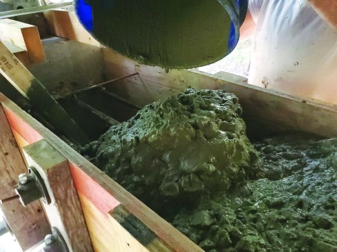 Use a stiffer mix of 2 to 3 inches for deeper work such as this footing.