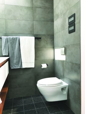 A wall-hung toilet lends the new bathroom a contemporary look.