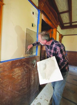 Pushing the brown coat hard against the old plaster helps key it in along the edge.