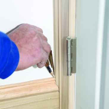 A compass scribe lets you transfer the door casing detail onto the end of the base cap. When cut, the base cap will fit into the contours of the casing.