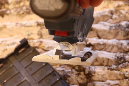 Tucked out of sight, but not out of reach, the speed adjustment dial offers another bit of control over cuts. While the saw's footplate only registers at 90 degrees, the gauge allows for finer miter adjustments.
