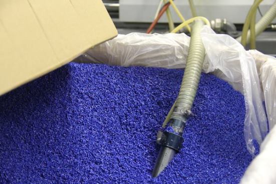 These engineered thermoplastic pellets are being pulled through the hose by a vacuum and fed into an injection molding machine. They will be used to produce blue twist on connectors. Winged connectors are made from a toughened co-polymer resin.