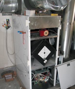 The air handler — a Lifebreath Clean Air Furnace — has a blower below, an HRV in the middle, and a pump and water-to-air heat exchanger coil above.