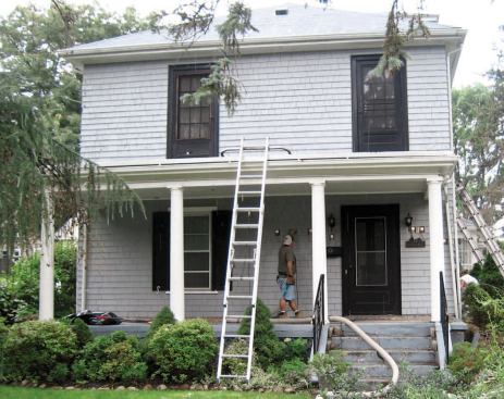 The wall cavities were first dense-packed from the outside with blown cellulose insulation.