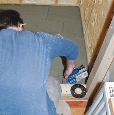 I troweled out modified thinset with a 1/4-inch-by-3/8-inch square-notch trowel.