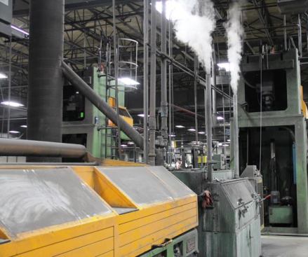 After the wire is drawn it enters a machine (the one with steam coming out the top) where it is cleaned in an acid bath and then rapidly dried.