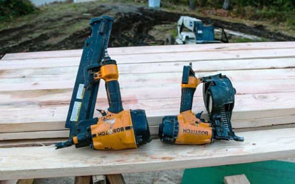 We also keep a regular pressure 
Bostitch LPF21PL (on the left) stick nailer in the truck for shooting galvanized framing nails. We use a stick nailer for this because hot dipped galvanized stick nails are cheaper and easier to find than HDG coil nails.