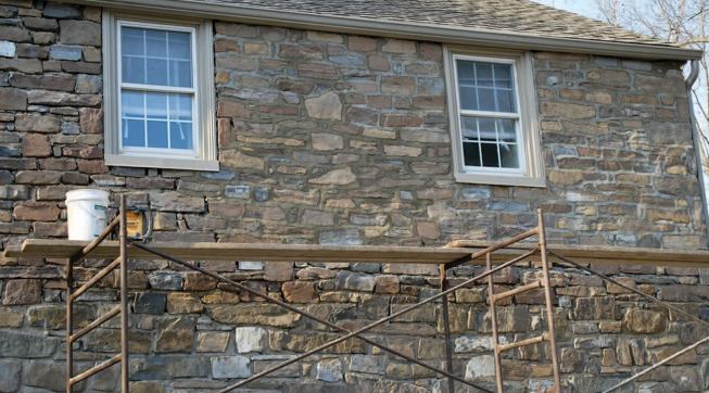 The new locally quarried stones should weather to more closely match the original.
