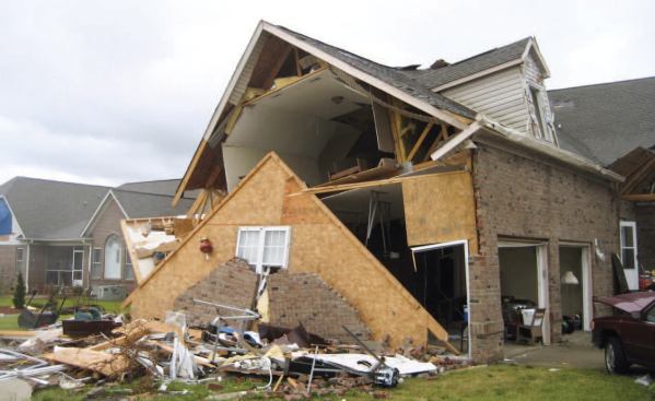 Damage to this home most likely started with the failure of the garage doors. Subsequent pressurization of the garage blew out the sidewall and pushed out the back wall.