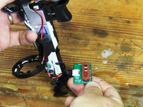 This is the speed selector switch (the tool has three speeds).