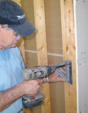 Swanson MAG squares — modified with holes drilled through their fences so that they can be screwed to the framing — make handy support brackets for panels.