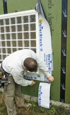 Either regular peel-and-stick flashing tape or 6-inch-wide Zip tape can be used to flash doors and windows to the wall panels.