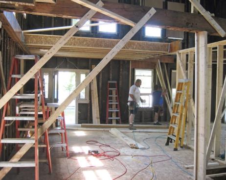 Diagonal braces prevented the exterior walls from spreading as the floors were reframed, a section at a time.