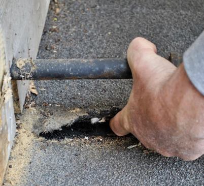 The old roof was an example of what not to do. The previous contractor had installed granulated roll roofing on a nearly flat roof.