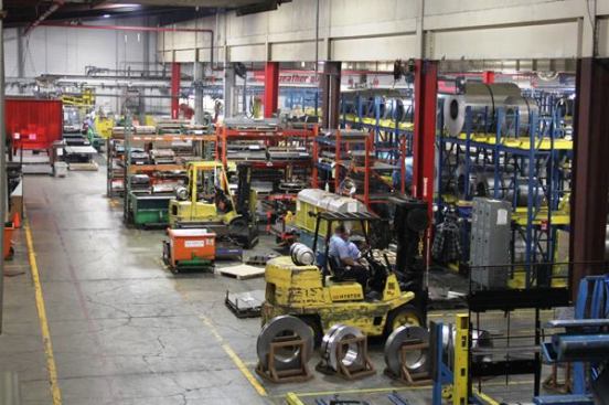 There is a lot of forklift traffic in the plant. Those red and yellow lines on the floor extend throughout the factory and show where it’s safe to walk. If you stay between the closely spaced red and yellow you’ll probably be okay. Cross the red without looking and you’re liable to be hit by a forklift.