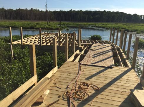 The boardwalk terminates in a 24-ft. x 30-ft. observation platform, as well as a floating boat launch.