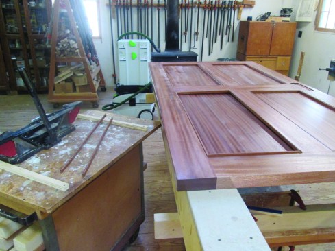 He then cuts the panels and prefinishes all the pieces with an initial coat of finish before installing the panels with an applied bead molding.
