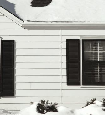 Damaging leaks may show up in subtle ways, like this line of ice emanating from behind the siding.