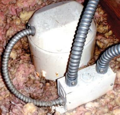 Uninsulated can lights are a common source of attic heat.