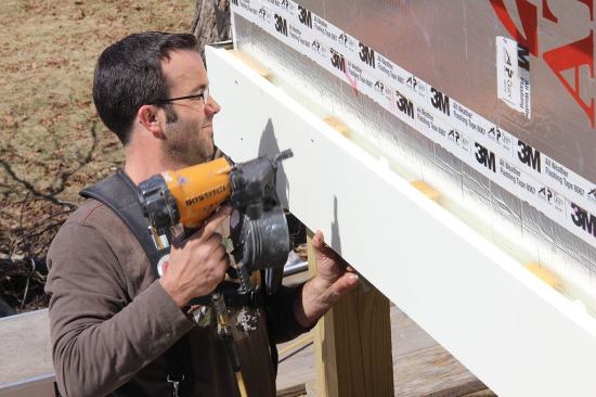 A closer look: Pollard fastens the pre-primed wood trim to the 1x4 rain screen furring using stainless steel ring shank nails.