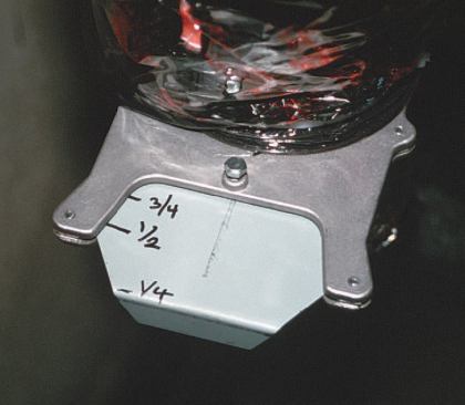 The author uses a standard blast gate to regulate fresh, outdoor makeup air entering the return plenum at a rate of about 10% of the total volume. Return air is drawn through a HEPA filter and conditioned before being returned to the living space.