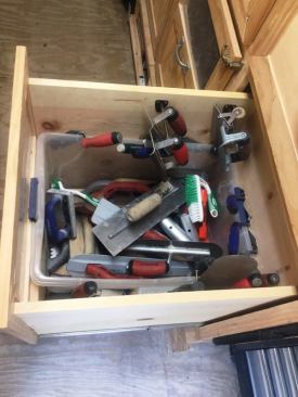 The next drawer down holds some of the floats, trowels, and edgers used for concrete and masonry work.