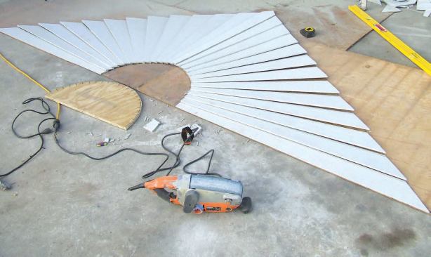 I next duplicated the half circle, placing a couple of fiber-cement cutoffs side by side and tracing around the plywood pattern.