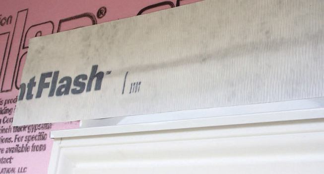 The metal drip caps were bedded in sealant, then sealed to the foam with flashing tape.
