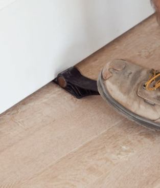 A foot-operated lever makes one-man door handling easier.