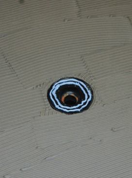 Sealant applied to the drain flange