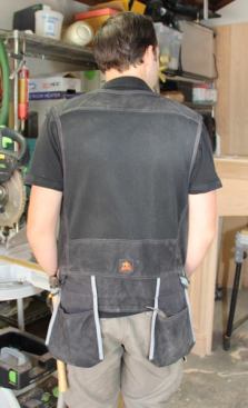 The large hanging pockets on the back of the vest are a good place to store hardware and large items such as a carpenter’s square. If you look closely you’ll see that the large piece of fabric – between the shoulders and waist – is mesh. There are smaller sections of mesh on the front. The mesh makes the vest noticeably cooler to wear in hot weather. You can’t see it here, but the shoulders themselves are padded, which makes the vest more comfortable to wear when heavily loaded with tools.