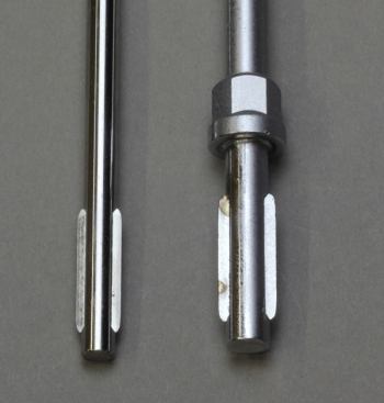 This is the end of the screwdriver that goes into the handle. Those wing-like projections were stamped into them to keep them from spinning within the handle. The nut-like piece welded onto the shaft on the right is a hex bolster, which can be used for wrench-assisted turning.