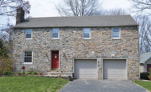 After: The new owners wanted to replace the vinyl with local stone that matched the rest of the front facade.