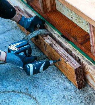 We use a Panasonic cordless impact wrench (
EY7551) with a 1/2-inch socket drive end along with an included bit holder that converts the tool into a standard 1/4-inch bit impact driver. Because of its drive versatility, we can use the tool to drive large anchor nuts as well as the 3 5/8-inch LedgerLok and 6- and 8-inch TimberLok screws we commonly use.