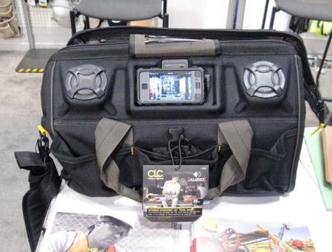CLC Tech Gear 18” MegaMouth Tool Bag. The A233 MegaMouth is a zippered gatemouth tool bag with a pair of built-in speakers that can be connected to portable audio devices such as iPods, MP3 players, or smart phones. Power is provided by an AC adaptor or four user-supplied D-cell batteries. The audio device slips into a clear plastic holder on the outside of the bag and connects to the speakers with a 3.5mm stereo jack. The A233 bag is available for purchase and has a suggested retail price of $119.
