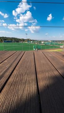 This is a closeup view of Eva-Tech's composite decking. The color is called Madagascar Rosewood.