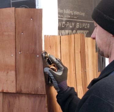 To fine-tune the fit, use a block plane to shave the shingle down close to flush with the wall.