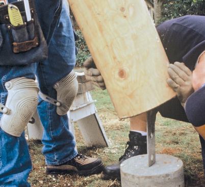 Placing the post is a two-person operation.