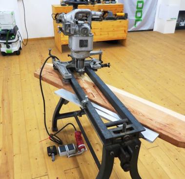 This very cool machine cuts dados for treads in stair stringers. It reminds me in some ways of the router devices used to cut mortises for mortise locks; you turn cranks and knobs this way and that—which advances and lowers the bit.
Click here to see it in action.