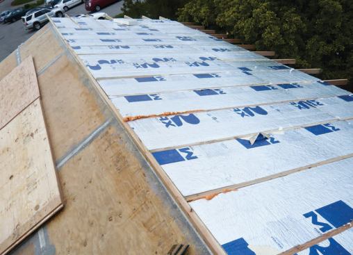 Foil-faced foam is cut to fit tightly between sleepers.