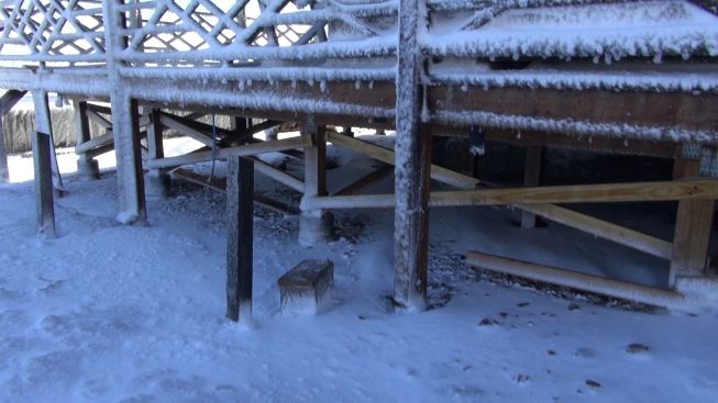 A view under the porch of Hackett’s neighbor’s house shows the structural repair Hackett effected when the porch collapsed in a previous storm. Hackett says he has repaired his own house eight times after damaging storms.
